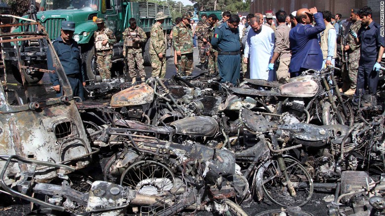 Security officials inspect the scene of the blast outside the Great Mosque in Herat.