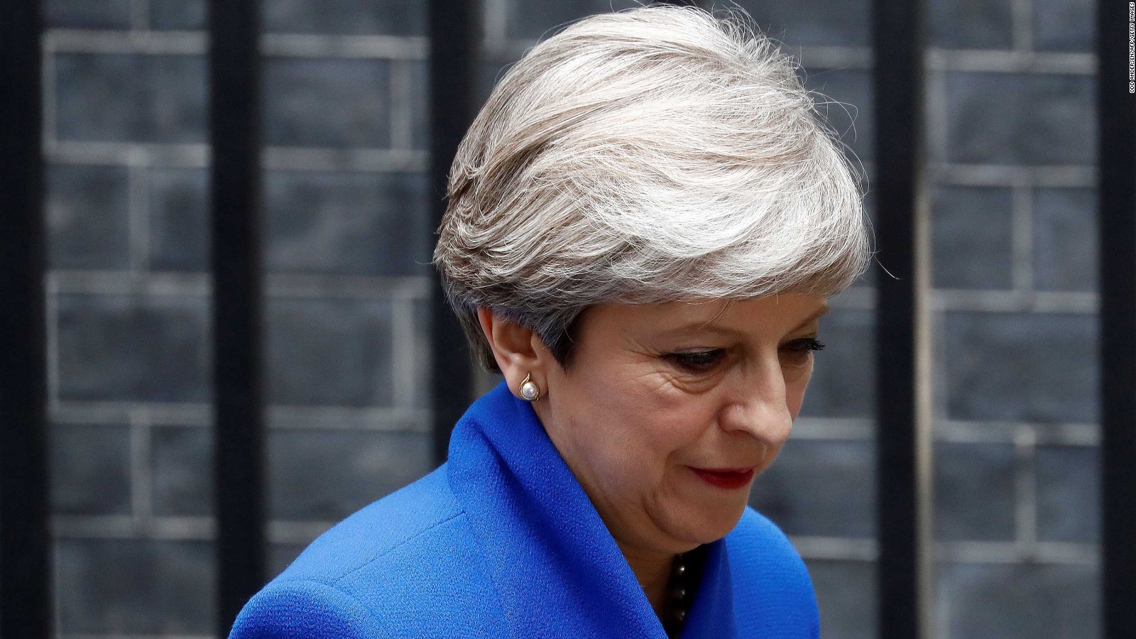 Britain's Prime Minister and leader of the Conservative Party Theresa May leaves 10 Downing Street in central London on June 9, 2017, en route to Buckingham Palace to meet Queen Elizabeth II, the day after a general election in which the Conservatives lost their majority.
British Prime Minister Theresa May will on Friday seek to form a new government, resisting pressure to resign after losing her parliamentary majority ahead of crucial Brexit talks. May is set to meet the head of state Queen Elizabeth II and ask for permission to form a new government, according to her Downing Street office. / AFP PHOTO / Odd ANDERSEN (Photo credit should read ODD ANDERSEN/AFP/Getty Images)