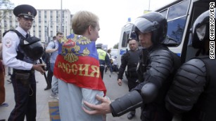 Police detain a participant of an unauthorized rally in Moscow&#39;s Tverskaya Street.
