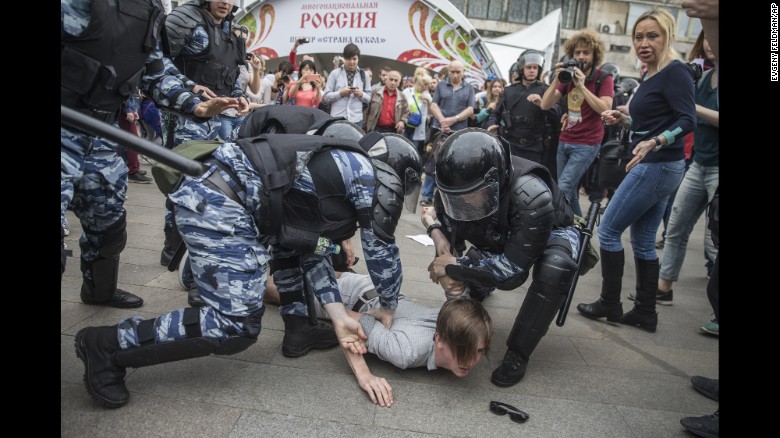 Police detain a protester In Moscow, Russia, Monday, June 12, 2017.