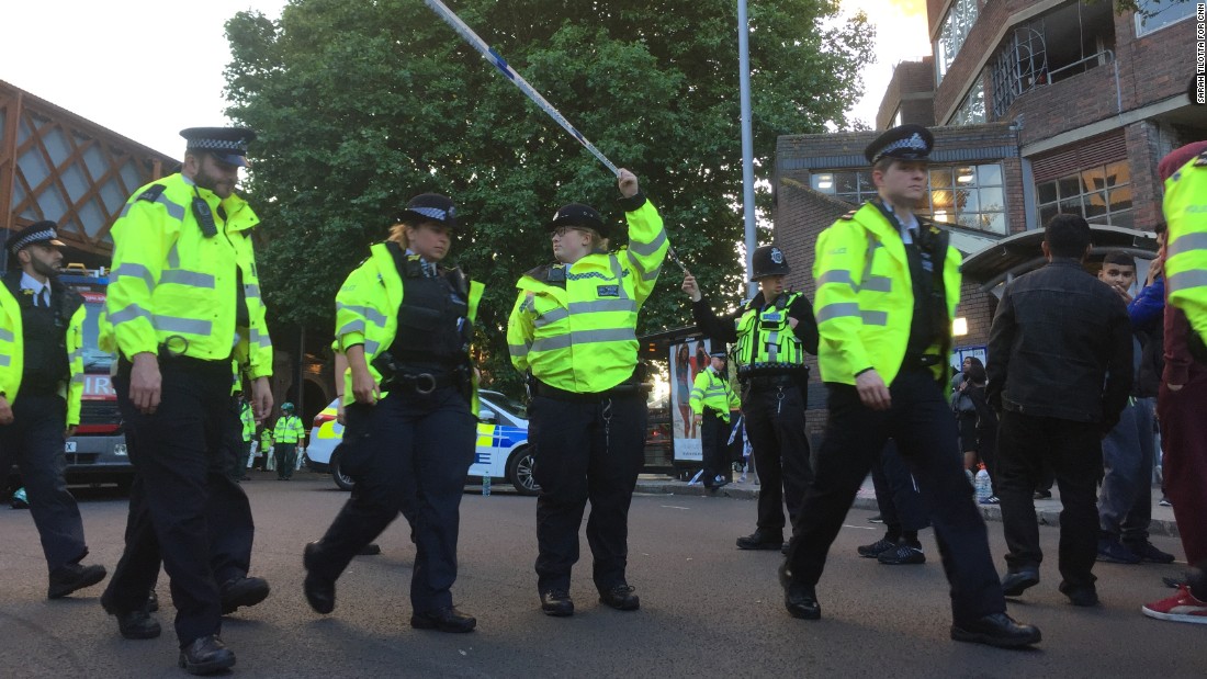 Police officers on nearby Bradley Road asked people to step back so they could expand the cordon and make more space for emergency services.