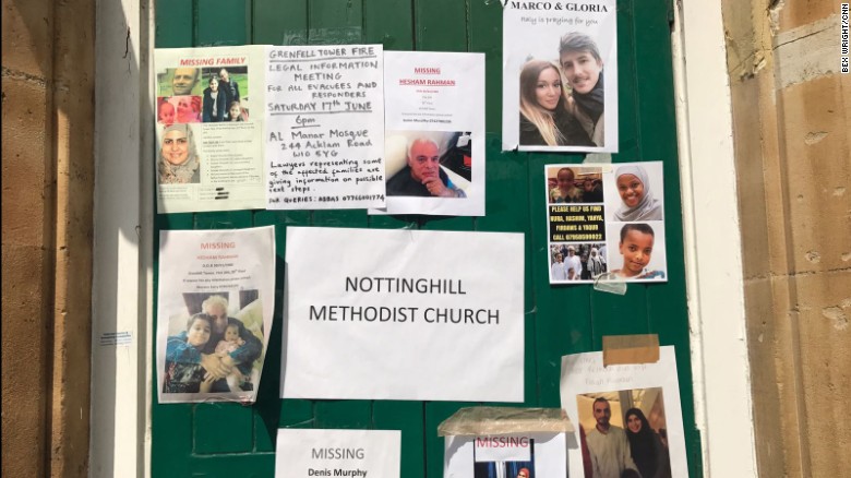 Missing people and informational flyers are posted on a door of the Notting Hill Methodist Church in west London on Sunday 18 June. 