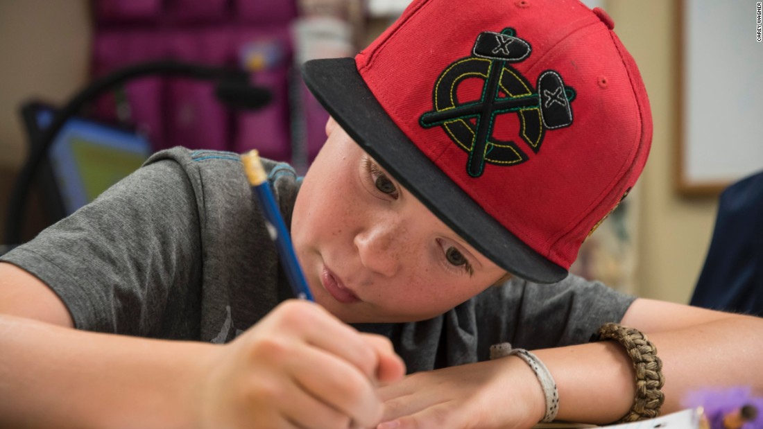 Ben Rosenberg, 11, of Boulder, Colorado, writes a letter to children in the Dadaab Refugee Camp in Kenya.