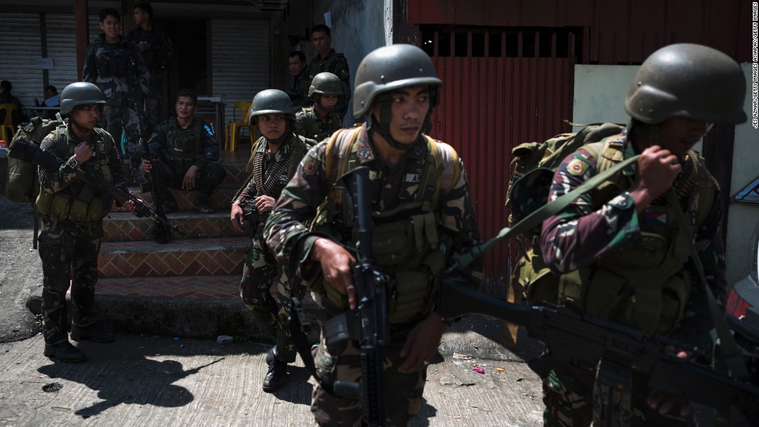 Soldiers being deployed to the front lines of Marawi are transported to safety on June 3, 2017, over a week after the siege began.