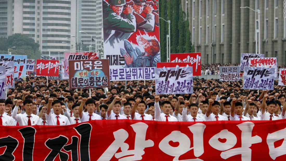 Tens of thousands of men and women pump their fists in the air and chant &quot;Defend!&quot; as they carry placards with anti-American propaganda slogans at Pyongyang&#39;s central Kim Il Sung Square Sunday, June 25, 2017, in Pyongyang, North Korea -- the anniversary of the start of the Korean War. In North Korea, it&#39;s called &quot;the day of struggle against US imperialism.&quot;