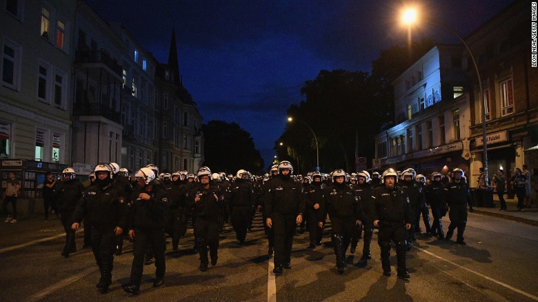Riot police walk down a road during the Welcome to Hell protest march on Thursday, July 6,  in Hamburg, Germany. Protesters clashed with authorities throughout the day while world leaders arrived for the G20 economic summit. The leaders of the group of 20 meet July 7 and July 8.
