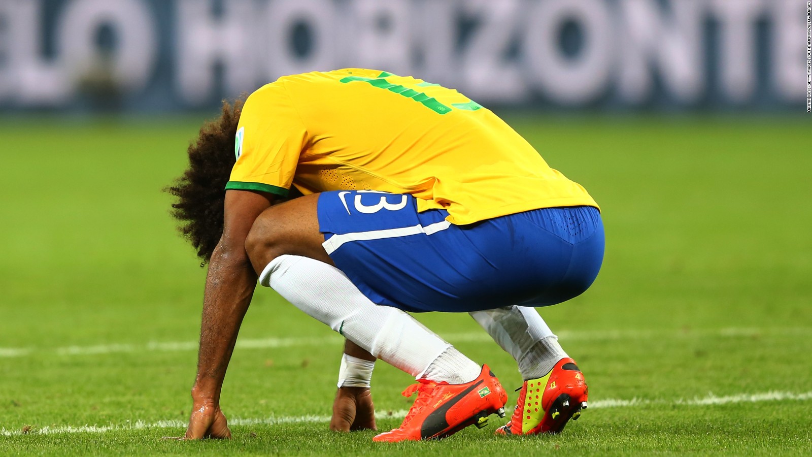 BELO HORIZONTE, BRAZIL - JULY 08: A dejected Dante of Brazil reacts after being defeated by Germany 7-1 during the 2014 FIFA World Cup Brazil Semi Final match between Brazil and Germany at Estadio Mineirao on July 8, 2014 in Belo Horizonte, Brazil. (Photo by Martin Rose/Getty Images)