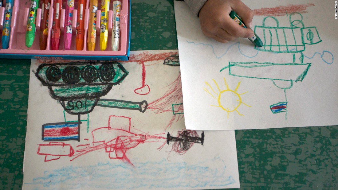 A child draws tanks and weapons during an art class in Pyongyang, North Korea. For North Korean children, the systematic indoctrination of anti-Americanism starts as early as kindergarten.