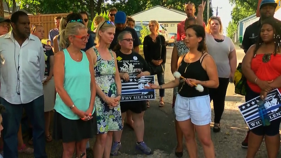 Members of Women&#39;s March Minnesota honor the victim of a police-involved shooting in a Sunday vigil.