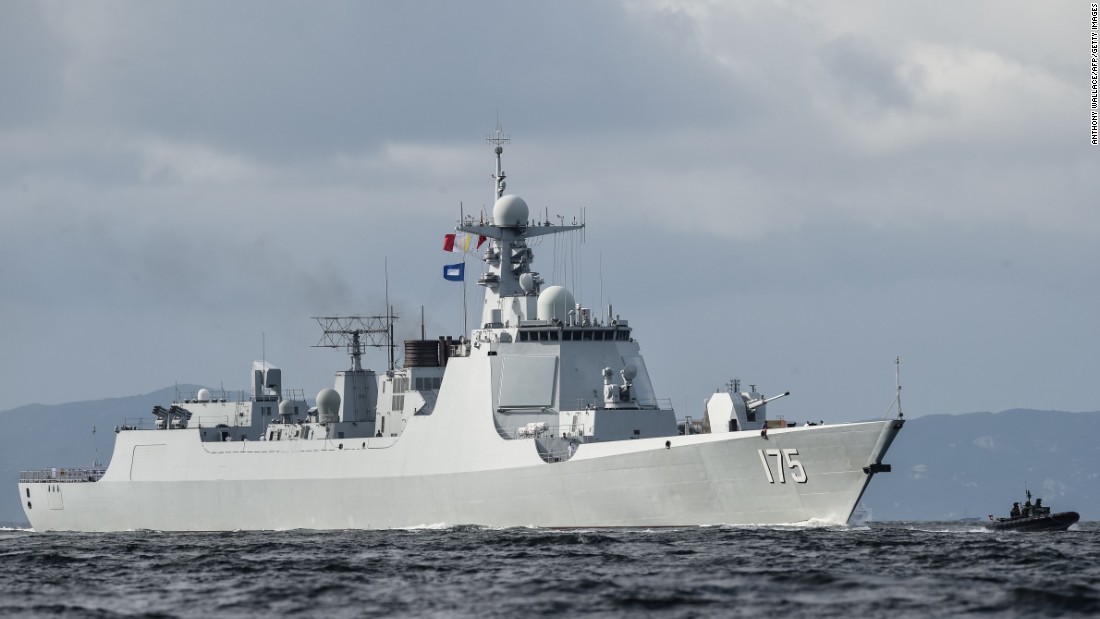 The Yinchuan (175), a Type 052D destroyer of China&#39;s People&#39;s Liberation Army Navy (PLAN), provides an escort ahead of the Liaoning aircraft carrier as it arrives in Hong Kong.