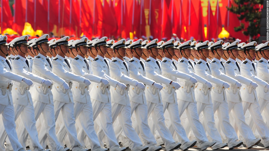 Chinese People&#39;s Liberation Army (PLA) naval officers march pass Tiananmen Square during the National Day parade in Beijing on October 1, 2009.  