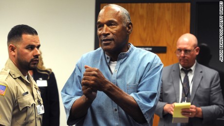 LOVELOCK, NV - JULY 20: O.J. Simpson (C) reacts after learning he was granted parole at Lovelock Correctional Center July 20, 2017 in Lovelock, Nevada. Simpson is serving a nine to 33 year prison term for a 2007 armed robbery and kidnapping conviction. (Photo by Jason Bean-Pool/Getty Images)