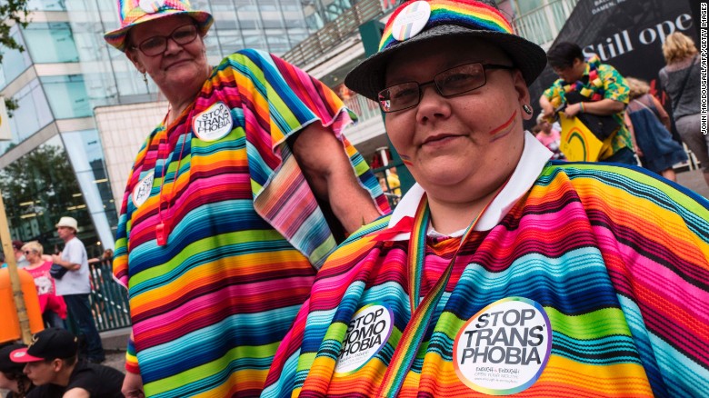 Dressed in vibrant, multi-colored outfits, some participants worn &quot;Stop transphobia&quot; stickers as well. 