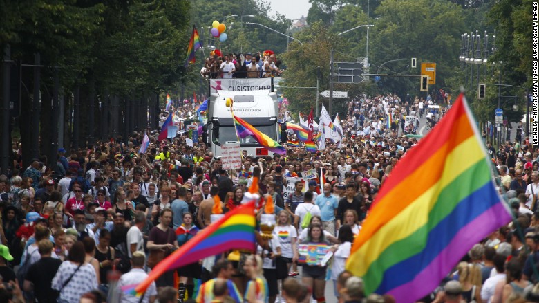 Paradegoers march alongside decorated trucks on Saturday during the 2017 Christopher Street Day gay pride celebration in Berlin, Germany.