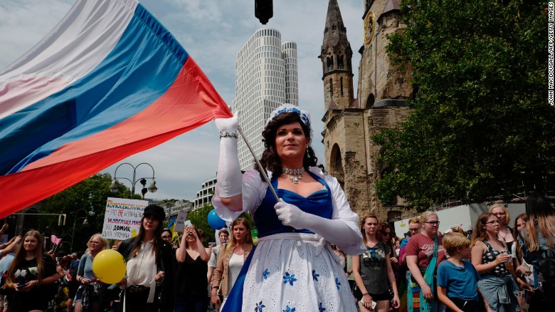 The parade saw people of all nationalities -- like this participant from Russia -- join the festivities. 
