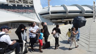 Montreal stadium turns into shelter for asylum-seekers who&#39;ve left US