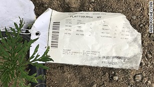 A ticket stub left behind shows a person took four buses to reach the Canadian border for asylum.