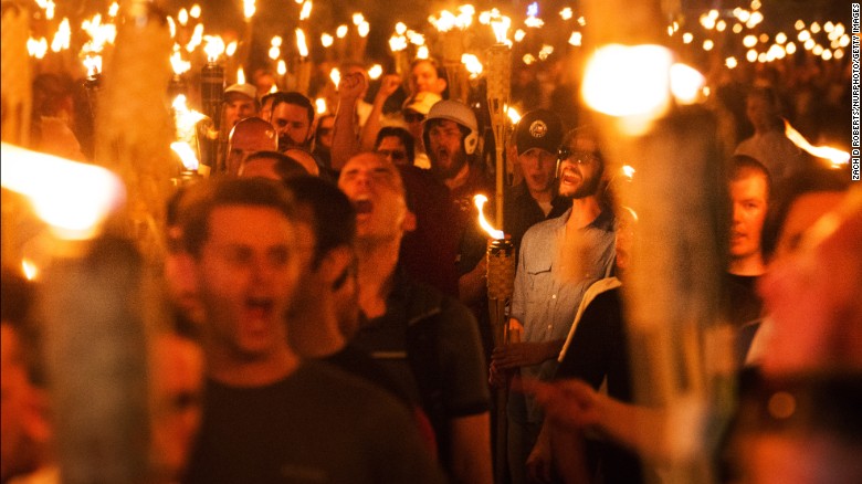White supremacists and others march through the University of Virginia capus on Friday night, the day before a &quot;Unite the Right&quot; rally in Charlottesville.