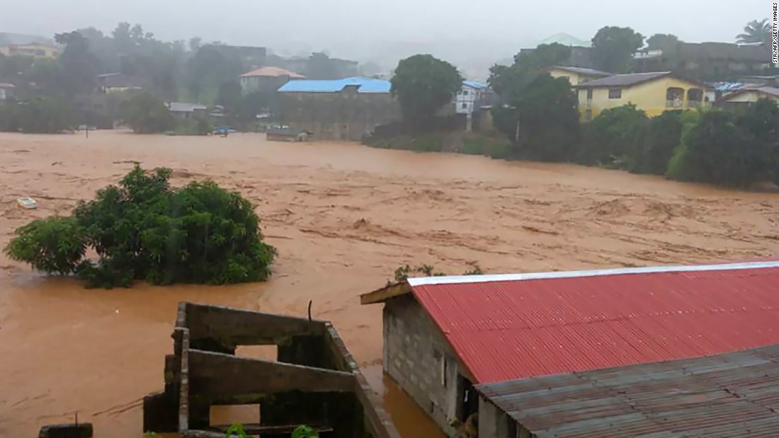 Water overflows the streets in Regent on Monday. 