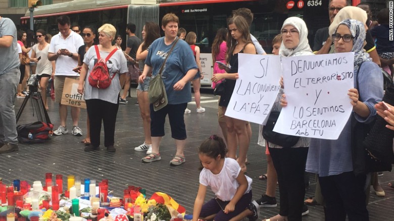 Muslimwomen denounce terrorism at a memorial Saturday on Las Ramblas in Barcelona.