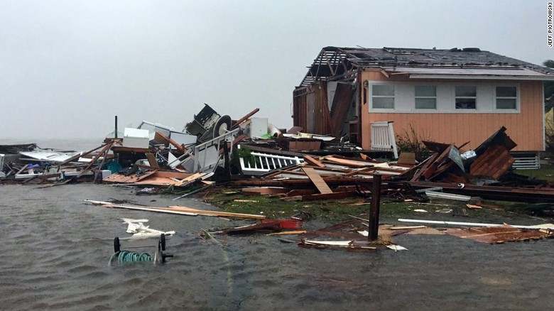 A damaged home sits amid a flood on August 26, 2017, after Hurricane Harvey slammed Rockport, Texas.