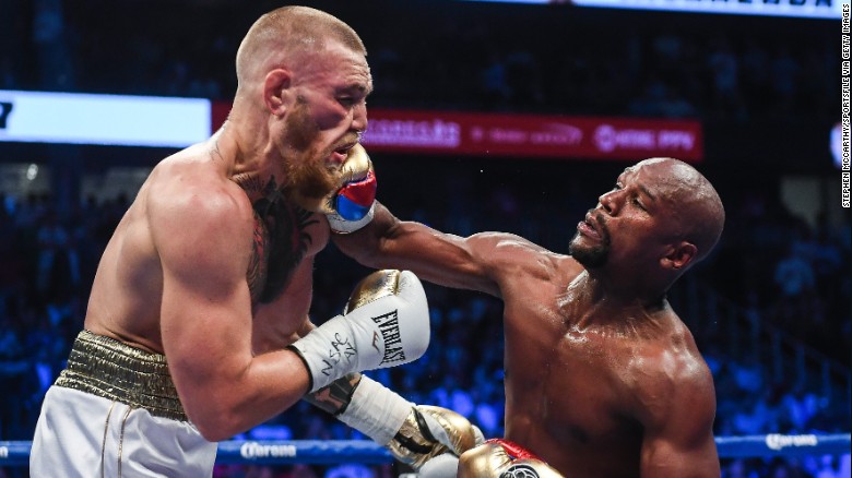 Floyd Mayweather Jr. lands a right hand against Conor McGregor during their boxing match in Las Vegas on Saturday, August 26. Mayweather <a href="http://www.cnn.com/2017/08/27/sport/mayweather-vs-mcgregor-fight/index.html" target="_blank">stopped McGregor in the 10th round,</a> collecting his 50th victory in what he said will be the last fight of his undefeated pro career. It was the first pro boxing match for McGregor, a mixed martial artist who is the UFC's lightweight champion.