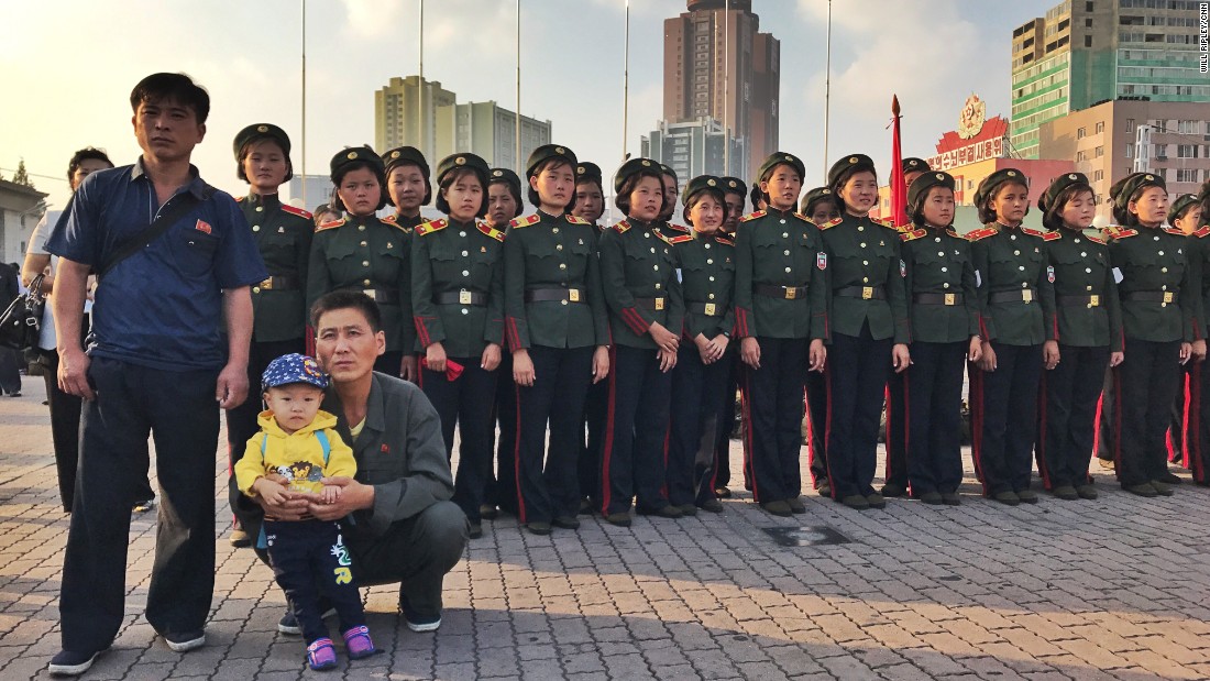 North Koreans watch news of the country&#39;s latest missile test be announced in Pyongyang on August 30.