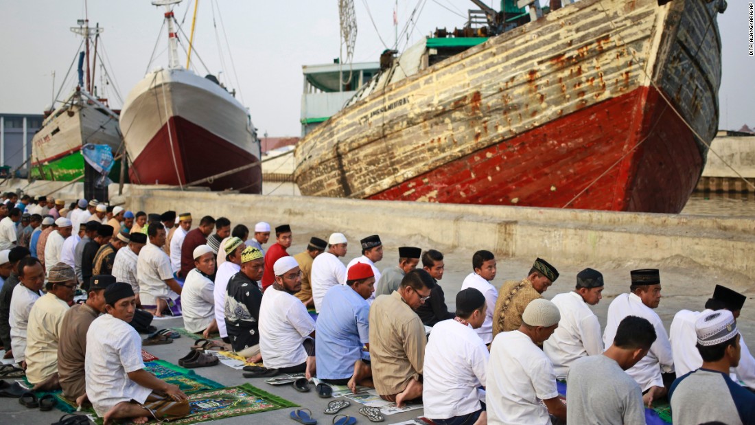 Muslim men attend a morning prayer marking Eid al-Adha at Sunda Kelapa port in Jakarta, Indonesia on Friday. 
