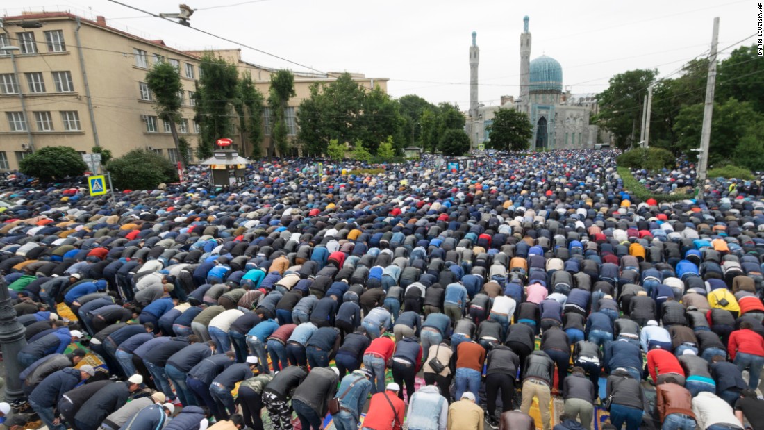 Muslims pray outside a mosque in St. Petersburg, Russia on Friday.