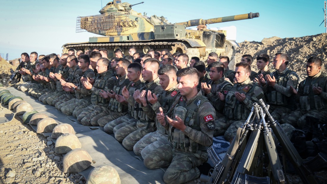 Turkish soldiers perform Eid al-Adha prayer at the base camp in Semdinli district of Hakkari, Turkey.
