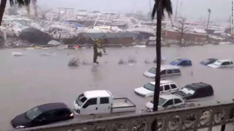 A harbor street in St. Martin left these vehicles flooded.