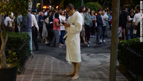 People gather on a street in downtown Mexico City during the quake. 