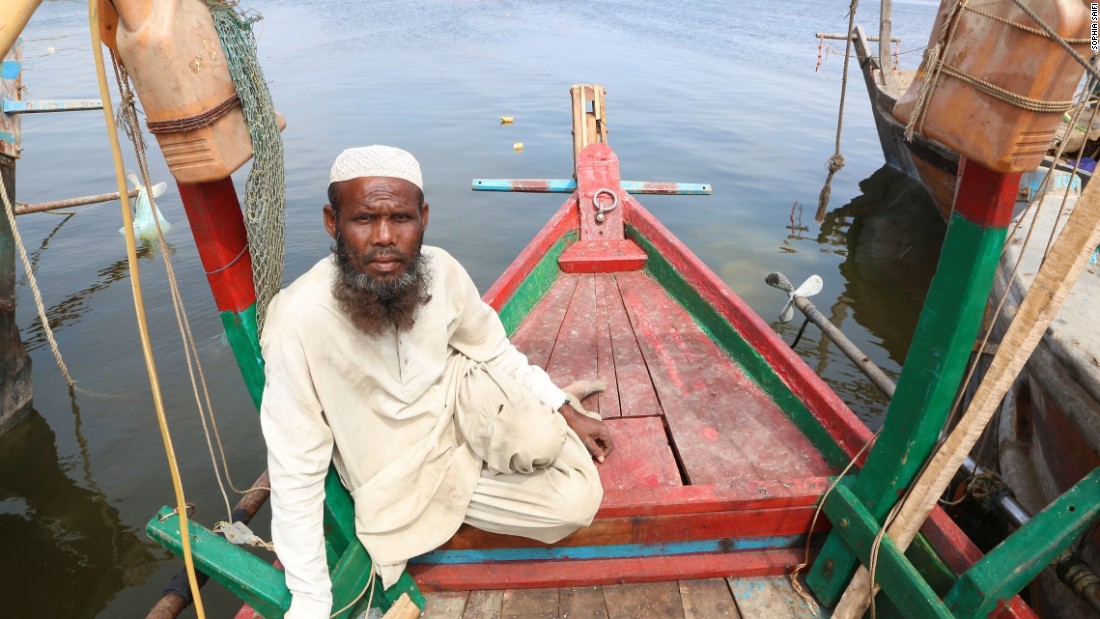 Fisherman, Mohammad Rasheed, 41, sits aboard a boat in southeastern Karachi.