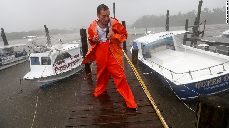 PJ Pike checks on his boat and on one belonging to a friend. Both are sitting in mud at their moorings due to an unusually low tide as the first effects of Hurricane Irma reach Fort Myers, Florida, on Sunday, September 10.