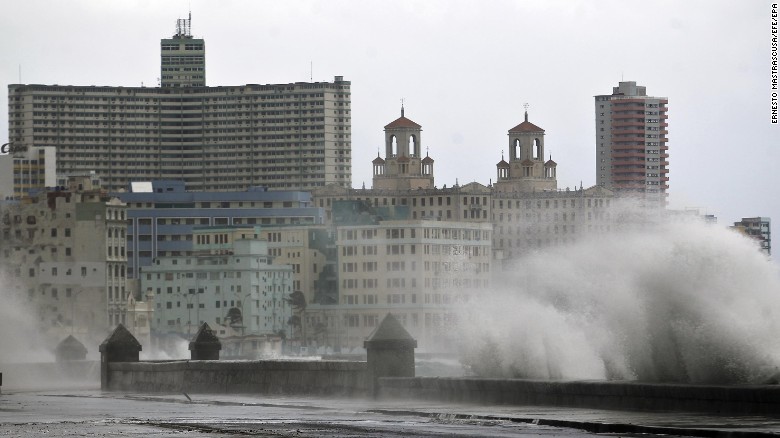 Water battered the city&#39;s pier and flooding some low-lying areas of Havana on Saturday. 