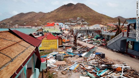 This general view shows buildings destroyed by Hurricane Irma on the French Caribbean island of Saint Martin on September 12, 2017, during the visit of France's President Emmanuel Macron . 
French President Emmanuel Macron and British Foreign Secretary Boris Johnson travelled Tuesday to the hurricane-hit Caribbean, rebuffing criticism over the relief efforts as European countries boost aid to their devastated island territories. / AFP PHOTO / POOL / Christophe Ena        (Photo credit should read CHRISTOPHE ENA/AFP/Getty Images)