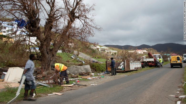 Workers remove debris on Thursday, September 14, in Friars Bay on the French Caribbean island of Saint Martin.  Hurricane Irma devastated the Caribbean island and others in the region.