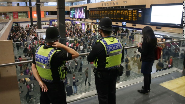 British Transport Police monitor activity Friday at Euston Station in London.