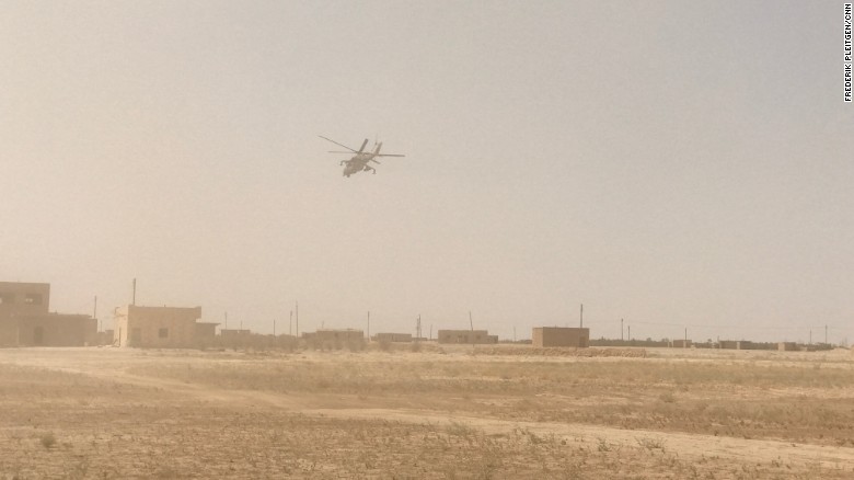 A Russian combat helicopter flies over Deir Ezzor, where there has been intense fighting against ISIS.