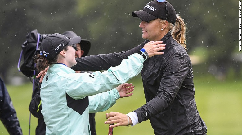Nordqvist and runner-up Brittany Altomare (left) embrace in the rain after the Swede clinched the title.