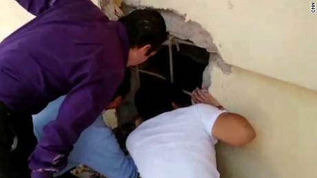 Moment kids found alive in collapsed school