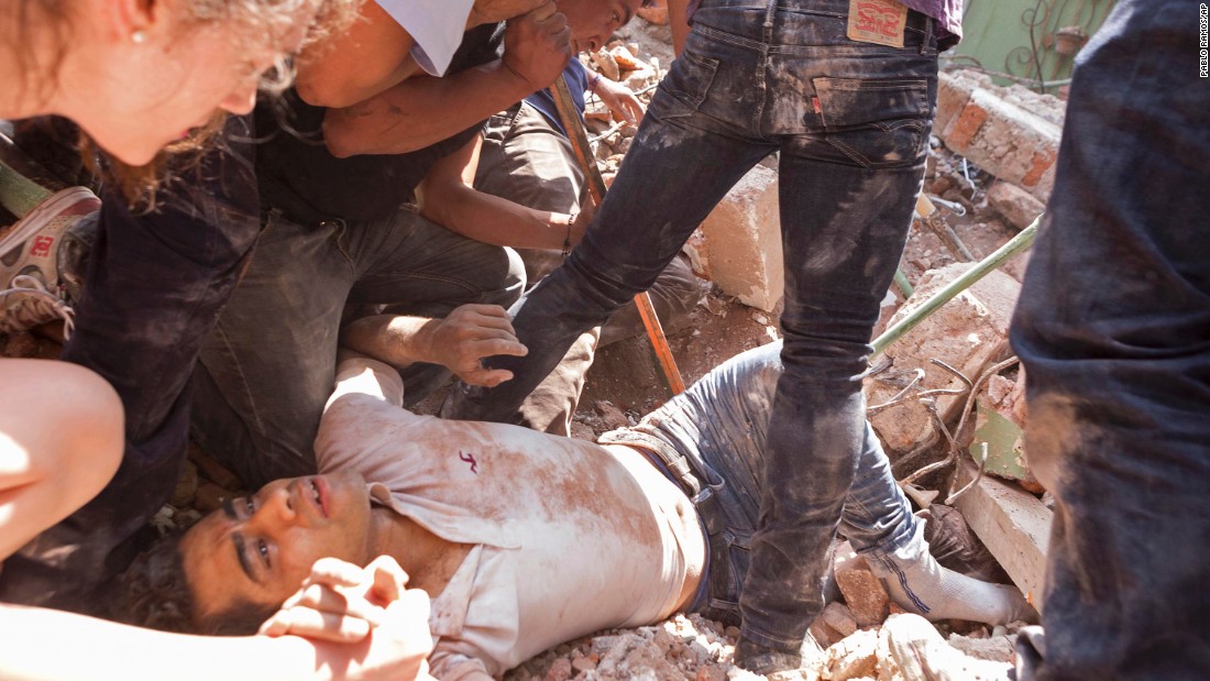 A man is rescued under rubble in Mexico City's Condesa area on September 19.