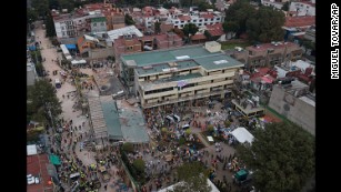 Mexico City crews race to save girl trapped in school rubble