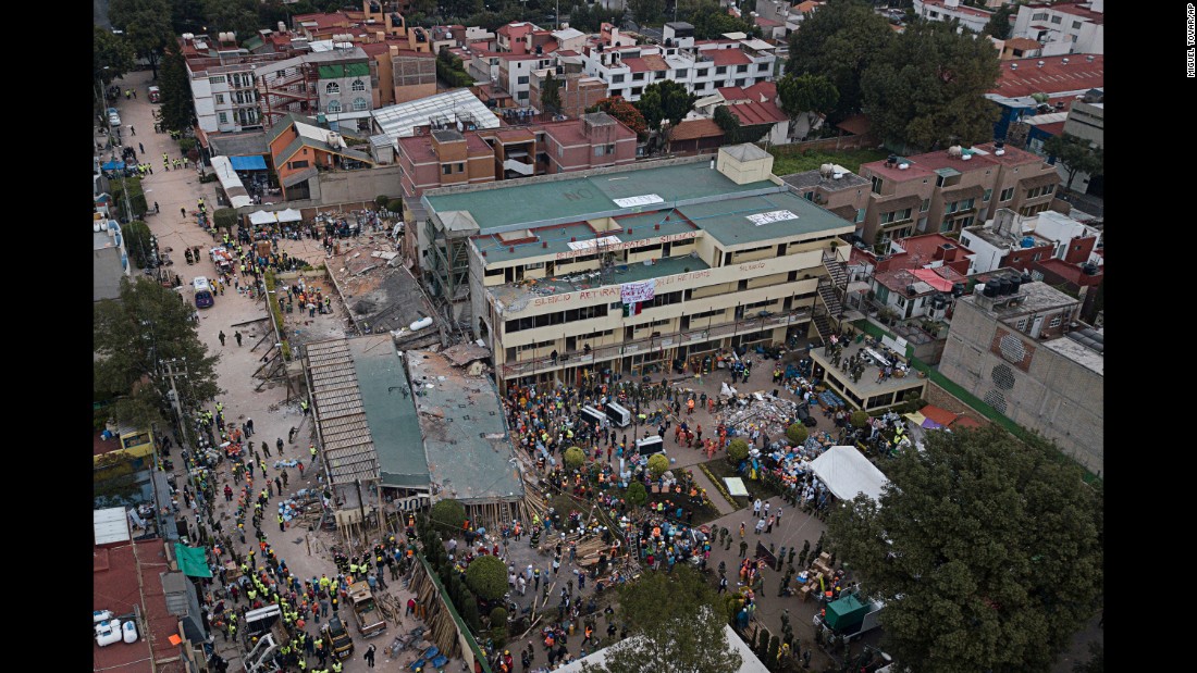 Volunteers and rescue workers search for people &lt;a href=&quot;http://www.cnn.com/2017/09/20/world/enrique-rebsamen-school-mexico-earthquake-trnd/index.html&quot; target=&quot;_blank&quot;&gt;trapped inside the Enrique Rebsamen elementary school &lt;/a&gt;on September 20. The school in Mexico City collapsed the day before.