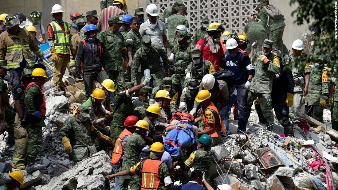 A survivor is pulled out of rubble in Mexico City on September 20.