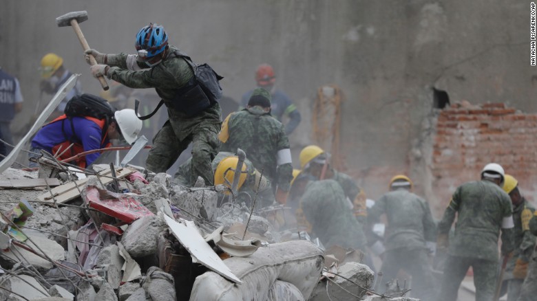 Rescue workers search for survivors Thursday, September 21, at a collapsed apartment building in Mexico City. A magnitude 7.1 quake &lt;a href=&quot;http://www.cnn.com/interactive/2017/09/world/mexico-quake-cnnphotos/&quot; target=&quot;_blank&quot;&gt;hit central Mexico&lt;/a&gt; two days earlier.