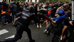 Spanish National Police clashes with pro-referendum supporters in Barcelona Sunday, Oct. 1 2017. Catalonia&#39;s planned referendum on secession is due to be held Sunday by the pro-independence Catalan government but Spain&#39;s government calls the vote illegal, since it violates the constitution, and the country&#39;s Constitutional Court has ordered it suspended. (AP Photo/Manu Fernandez)
