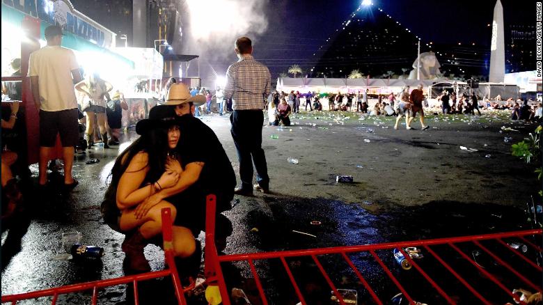 A couple huddles after shots rang out at a country music festival on the Las Vegas Strip on Sunday, October 1. At least 58 people were killed and almost 500 were injured when <a href="http://www.cnn.com/2017/10/02/us/las-vegas-shooter/index.html" target="_blank">a gunman opened fire</a> on the crowd. Police said the gunman, 64-year-old Stephen Paddock, fired from the Mandalay Bay hotel, several hundred feet southwest of the concert grounds. He was found dead in his hotel room, and authorities believe he killed himself and that he acted alone. It is the deadliest mass shooting in modern US history.