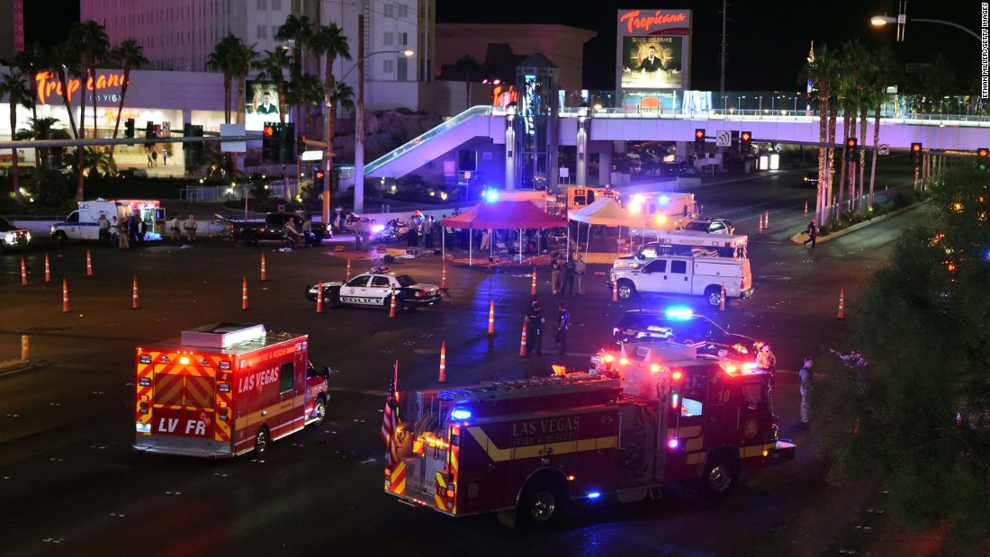 Police and emergency responders gather at the intersection of Las Vegas Boulevard and Tropicana Avenue in response to the shooting.