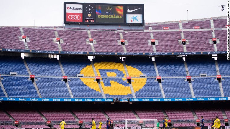 The word &#39;Democracia&#39;, Catalan for &#39;Democracy&#39;, is displayed in the Camp Nou stadium board during FC Barcelona&#39;s match.